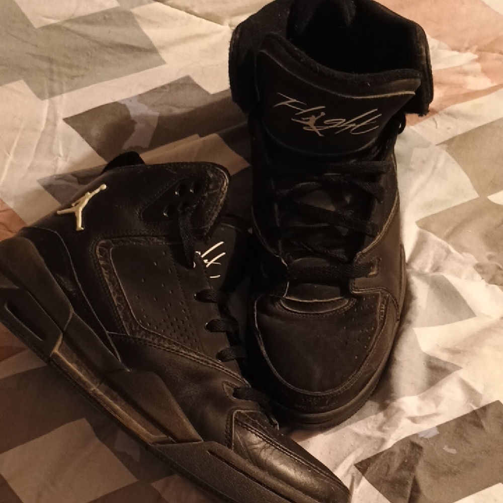 Nike Black High-Top Sneakers with Gold Accents